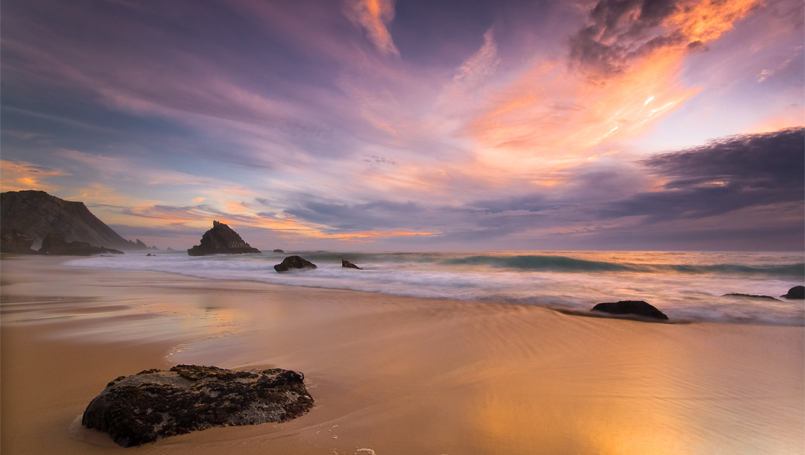 Rocky beach at sunset